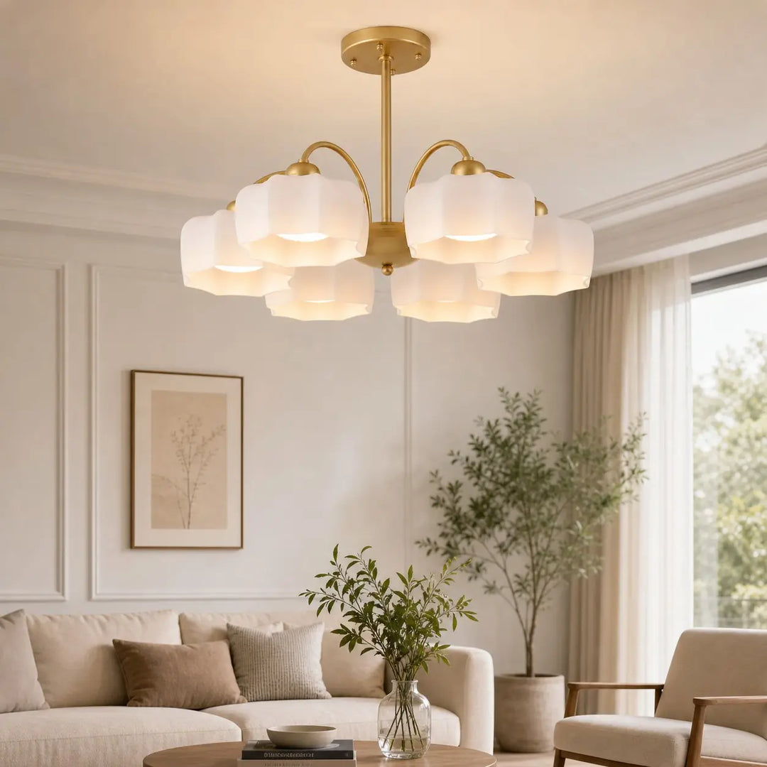 6-light gold chandelier installed in a bright living room