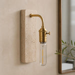 Bild in Gallery-Viewer laden, Gold travertine wall sconce installed beside a mirror