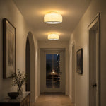Load image into Gallery viewer, Illuminated amber glass ceiling light in an arched hallway