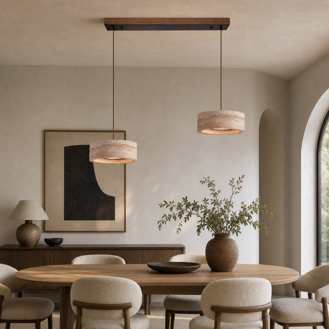 Two-light yellow travertine linear LED pendant in a dining room