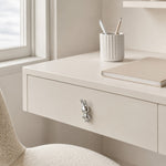 Cargar imagen en el visor de la Galería, Chrome silver rabbit knob on a white desk drawer