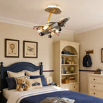 Bild in Gallery-Viewer laden, Airplane ceiling light over a blue kids bed