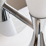 Cargar imagen en el visor de la Galería, Polished chrome hourglass frame detail on white glass wall lamp