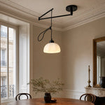 Load image into Gallery viewer, Black pendant installed in a dining space