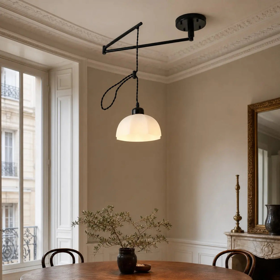 Black pendant installed in a dining space