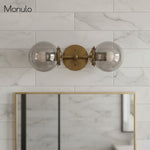 Cargar imagen en el visor de la Galería, Lámpara de tocador de baño moderna de estilo industrial Lumio Globe de cristal transparente
