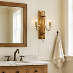 Load image into Gallery viewer, Vintage brass crystal double wall sconce installed beside a bathroom mirror