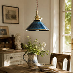 Bild in Gallery-Viewer laden, Blue ceramic pendant light above a vintage tea table near a window