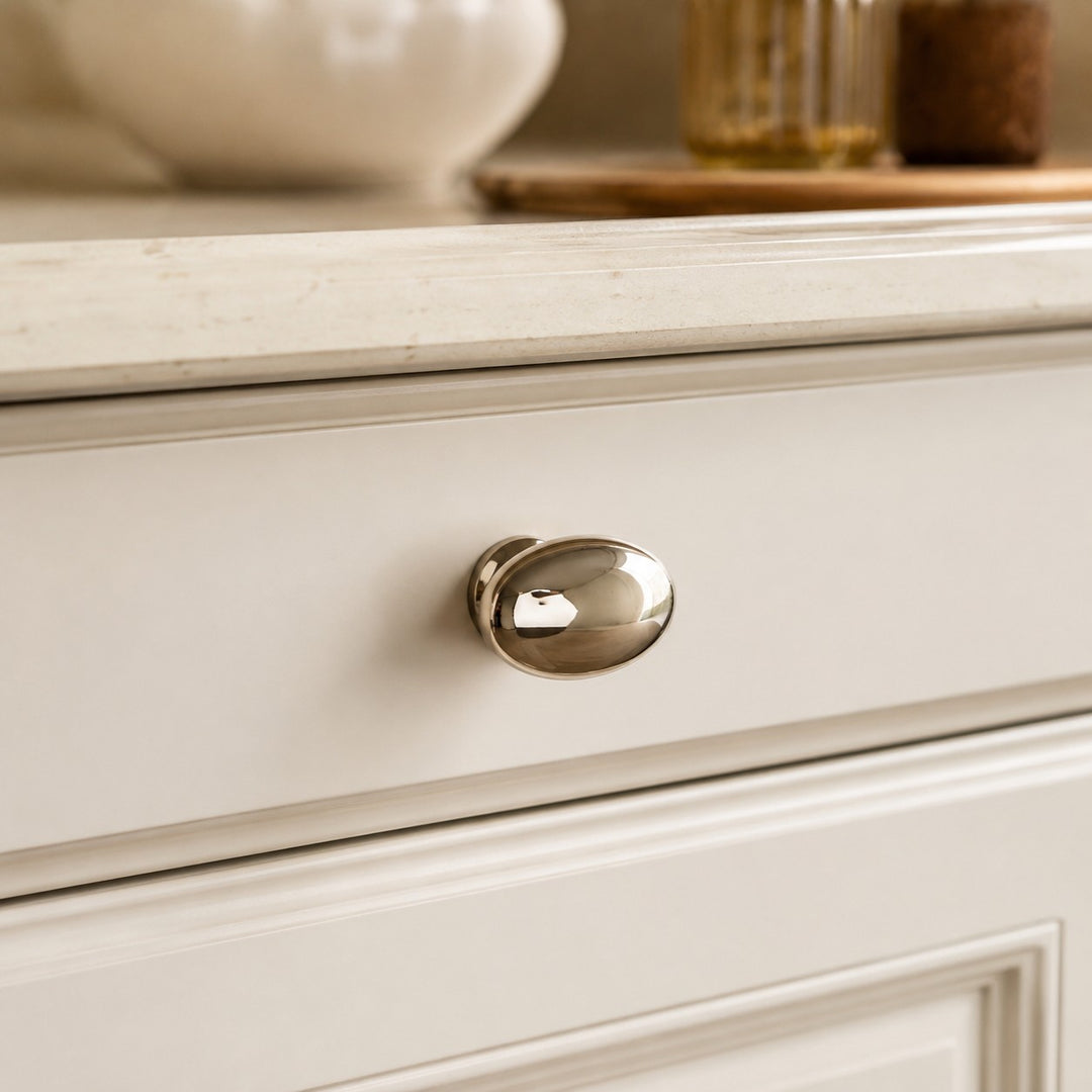 Solid brass cabinet knob installed on furniture
