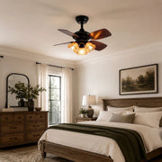 Black amber glass ceiling fan light installed in a bedroom