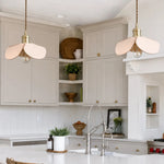 Load image into Gallery viewer, Leather petal pendant lights over a bright kitchen island