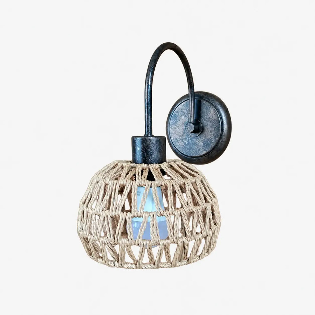 Shade A woven rattan wall sconce in antique brass