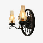 Cargar imagen en el visor de la Galería, Black wagon wheel wall sconce with two light heads