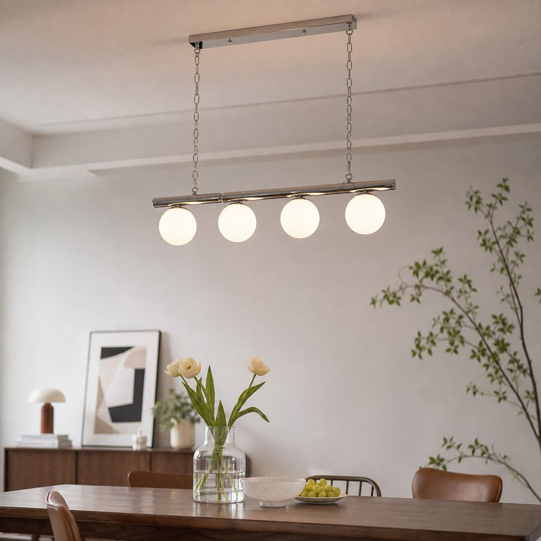 White globe chandelier above a dining table