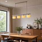 Load image into Gallery viewer, Cream layered glass chandelier in a warm dining room