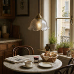 Load image into Gallery viewer, brass pendant light above a dining table