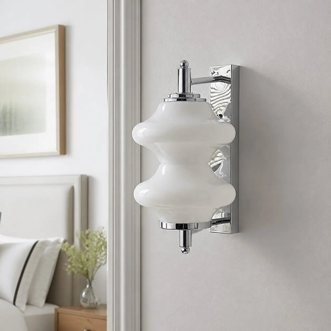 White glass wall light installed in a hallway