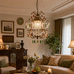 Load image into Gallery viewer, Vintage crystal pendant light in a warm living room