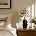Load image into Gallery viewer, Matte black floral table lamp styled on a bedroom nightstand