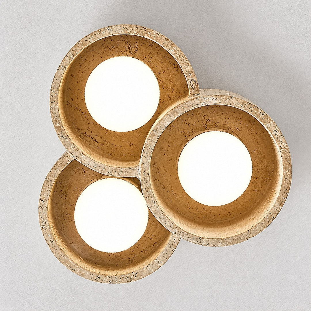 Bottom view of three round travertine light openings