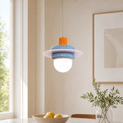 Sea salt blue pendant light installed near a bright window