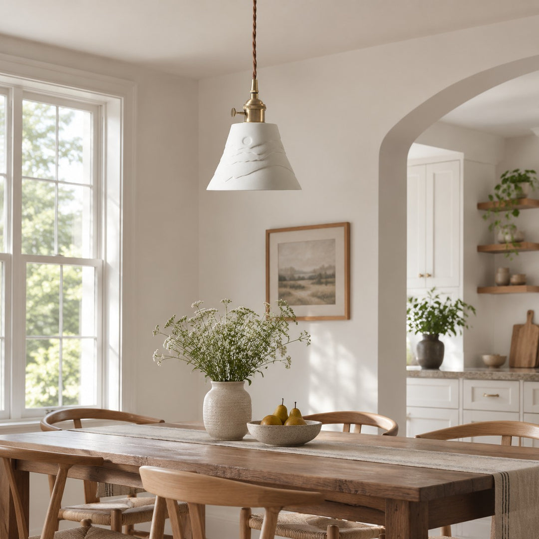 Ceramic pendant light above a daylight dining table