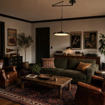 Load image into Gallery viewer, Black movable pendant light in a dark classic living room