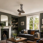 Cargar imagen en el visor de la Galería, Compact ceiling fan in a green living room with sofa and fireplace