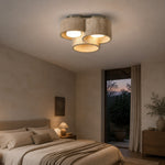Bild in Gallery-Viewer laden, Three head travertine ceiling light in a warm bedroom