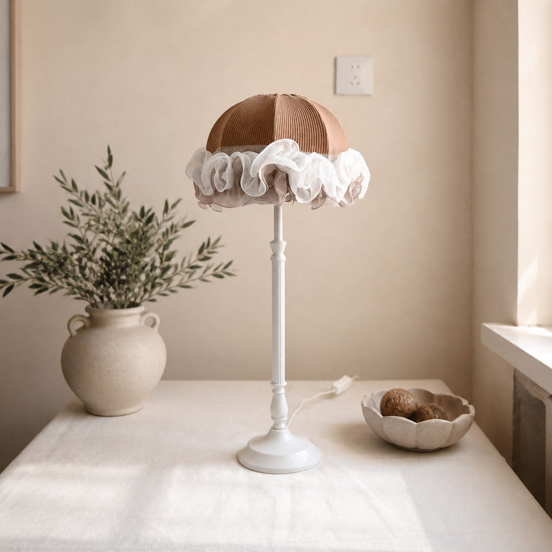 French vintage table lamp beside window with tabletop decor