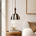 Charger l'image dans la visionneuse de galerie, Black and ivory fabric pendant lamp above a side table beside a lounge chair