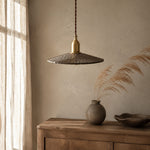 Load image into Gallery viewer, Octagonal wood pendant light beside a cabinet and window