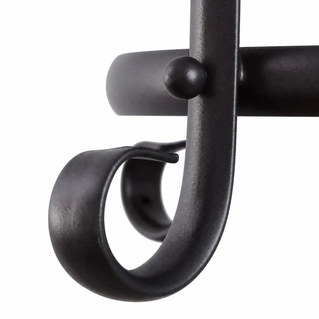 Curved black iron scrollwork detail