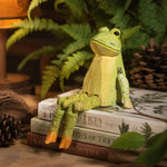 Cargar imagen en el visor de la Galería, Hand-carved wooden frog ornament styled on a tabletop edge
