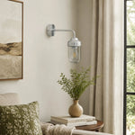 Load image into Gallery viewer, Aluminum glass wall sconce installed beside a sofa and window