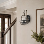 Load image into Gallery viewer, Rust metal clear glass wall sconce installed near staircase