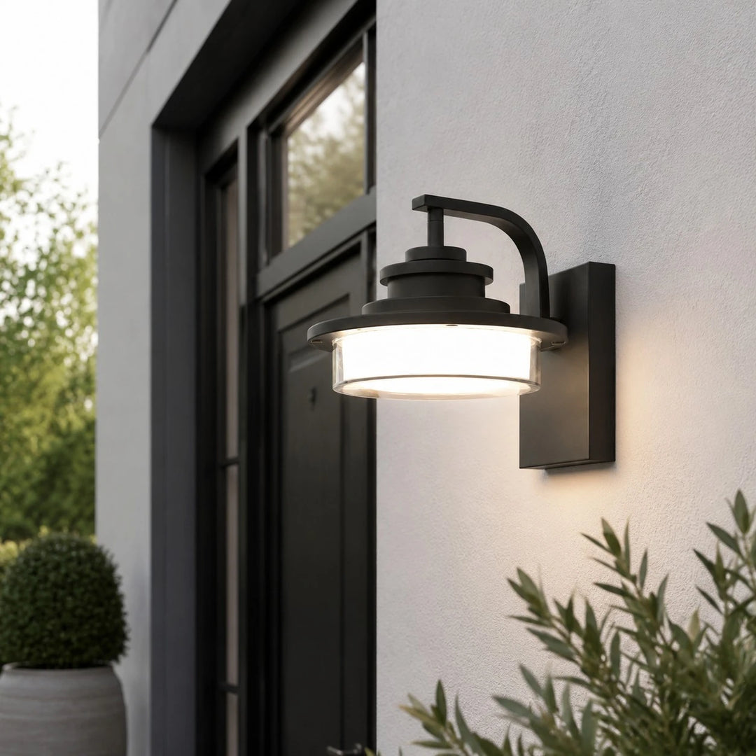 Round outdoor wall light installed beside a window