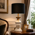 Load image into Gallery viewer, Gold motif table lamp styled beside an upholstered chair