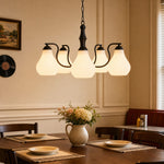 Bild in Gallery-Viewer laden, Vintage five-heads chandelier above a dining table
