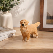 Light wood-tone dog ornament on a desk with decor