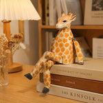 Cargar imagen en el visor de la Galería, Hand-carved wooden giraffe ornament styled on a tabletop edge