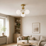 Load image into Gallery viewer, Gold globe ceiling light installed in a living room