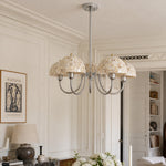 Cargar imagen en el visor de la Galería, Beige shell five-light chandelier installed in an elegant dining room