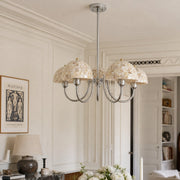 Beige shell five-light chandelier installed in an elegant dining room