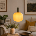 Bild in Gallery-Viewer laden, Yellow glass pendant light in a styled living room