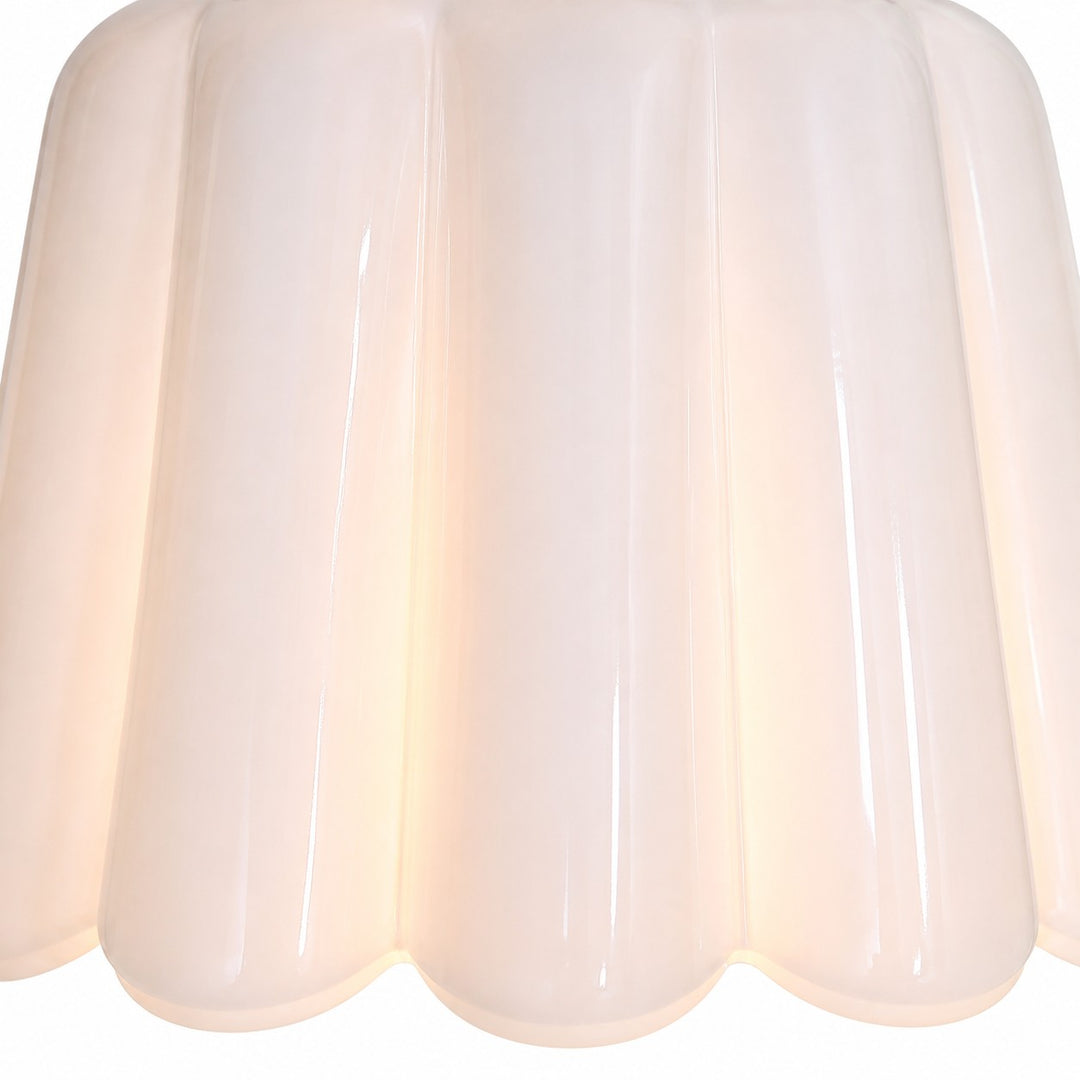 Close view of white scalloped ceramic shade