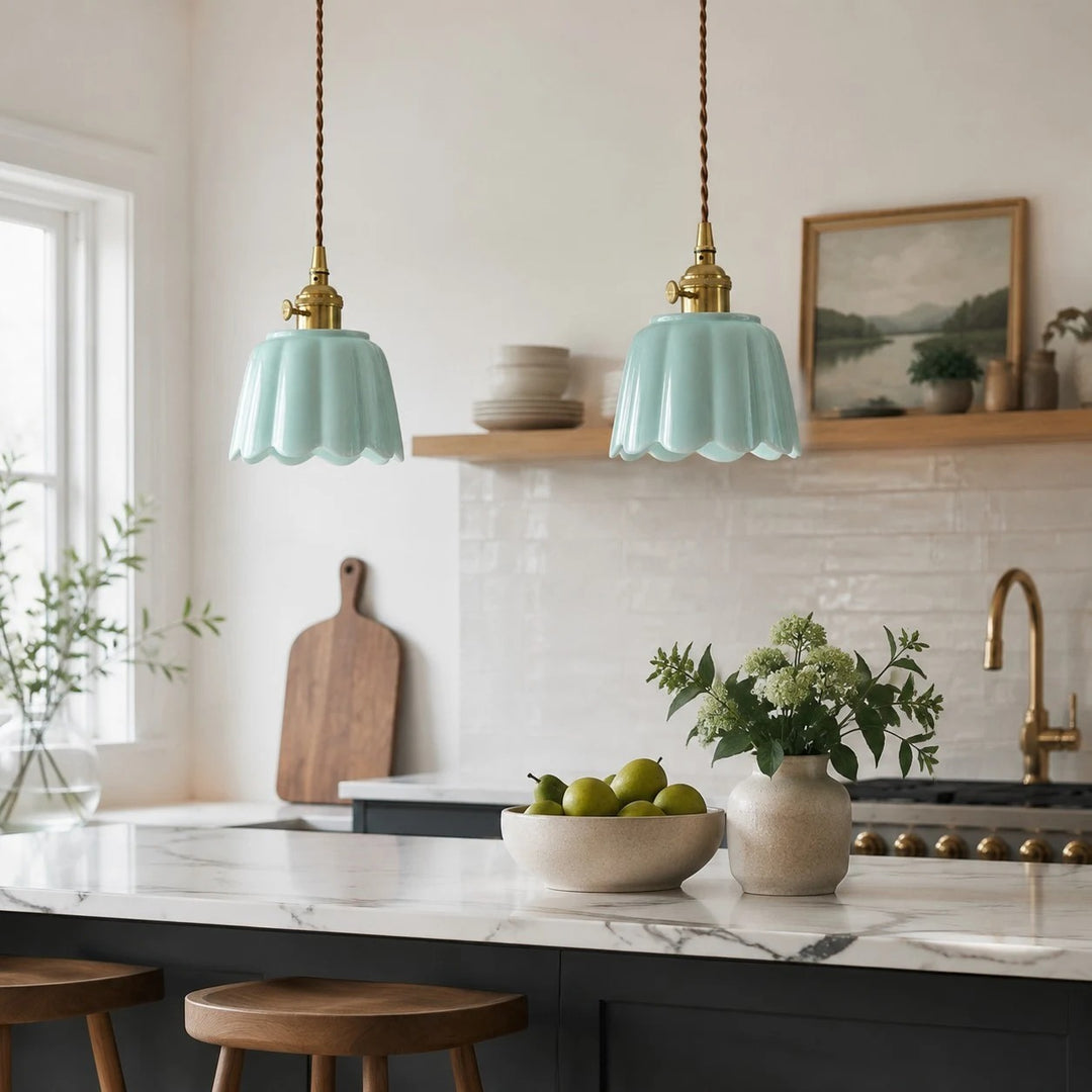 Pair of ceramic lotus pendants over a kitchen island