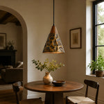 Bild in Gallery-Viewer laden, Single hammered copper pendant beside a dining table