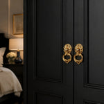 Cargar imagen en el visor de la Galería, Brass ring pulls on a dark wardrobe