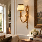 Bild in Gallery-Viewer laden, One-head brass wall sconce mounted beside framed wall artwork